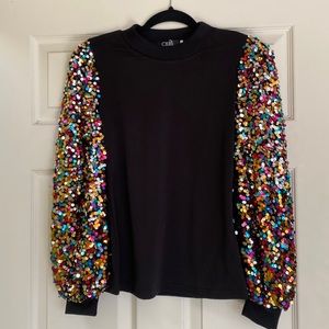 New Year’ Eve and holiday sparkle. CBR black top with multi-colored sleeves. S